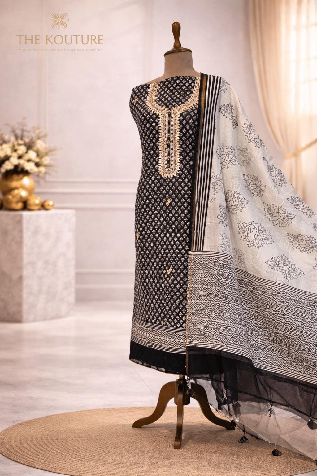 Black and off-white cotton suit set with Dupatta for Women displayed elegantly on a mannequin.