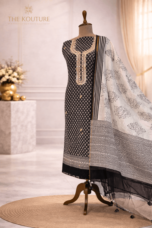 Black and off-white cotton suit set with Dupatta for Women displayed elegantly on a mannequin.