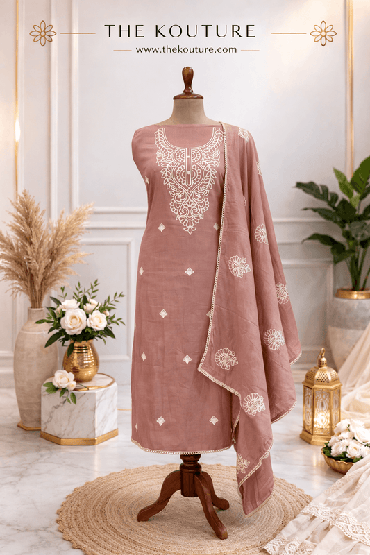 Blush pink cotton suit set with Dupatta for Women, featuring intricate embroidery and elegant design, showcased in a stylish setting.