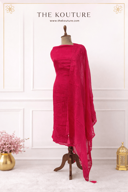 Elegant rani pink suit set with Sheer Dupatta for Women displayed on a mannequin.