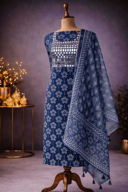 Indigo cotton suit set featuring mirror work kurta and printed dupatta displayed on a mannequin.