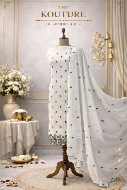 Ivory and black embroidered suit set with Scalloped Dupatta.